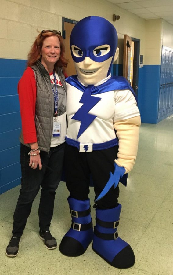 Mrs. Rader with the new school mascot, on the day it was introduced to the students and staff for the first time. It still remains a mystery who was behind the mascot’s mask that day. (Photo courtesy of Jodie Tiger)