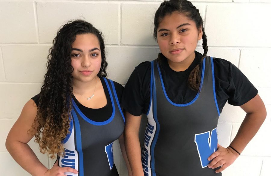 Cory Perez, left, said that her goal for this season is to properly learn the movements and win a match.  Merlyn Garcia, right, said that her goal is to: “Try to at least win a match or more.”  (Photo by Jayne Lewis)
