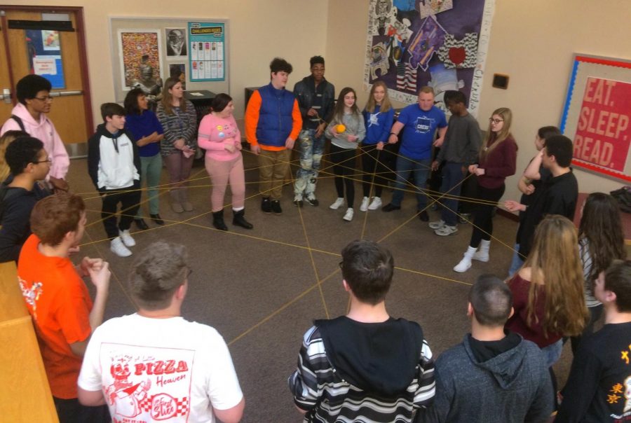 Best Buddies member Vanessa Falzarano, far right, explains the yarn game. (Photo by Mary Ann McKinney)