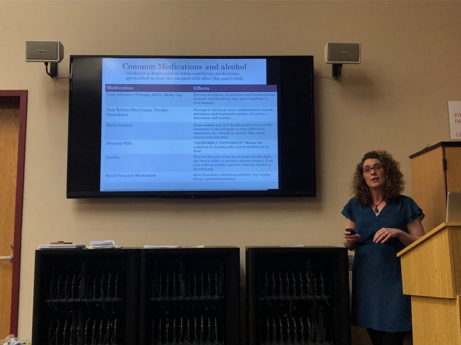 Peggy King talks to students about the risks of abusing alcohol and nicotine, particularly over spring break. (Photo by Kirsten Dorman)