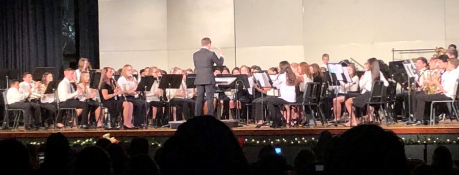 The+combined+Concert+Band+and+Wind+Ensemble%2C+conducted+by+Band+Director+Jason+Graf%2C+perform+at+the+Fall+Concert+on+Dec.+4+in+the+Warren+Hills+Regional+High+School+Auditorium.+Band+students+had+been+preparing+for+the+Fall+Concert+since+early+September%2C+practicing+selections+such+as+Among+the+Clouds+and+Entry+of+the+Gladiators.+We+had+a+snow+day+on+Monday%2C+so+we+missed+that+one+day+of+being+able+to+prepare%2C+but+everything+came+together%2C+Graf+said.+The+combined+band+especially+sounded+really+great+playing+and+the+audience+enjoyed+it.+Other+upcoming+performances+involving+the+bands+include+the+Prism+Concert%2C+scheduled+for+March+4%2C+and+the+Spring+Concert%2C+scheduled+for+May+6.+%28Photo+by+Samantha+Bradley%29