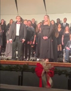 The Warren Hills Concert Choir and Advanced Choir, featuring Sophomore Bryant Aguirre (left) and Junior Maggie Alder, perform “Where Are You Christmas?” at the Winter Choral Concert Dec. 11. The Concert Choir, Advanced Choir, Select Choir, and Rock and Pop performed at the concert. Songs included “No Room,” by the Select Choir, and “Slow Rockin’ Christmas,” by the Rock and Pop Choir. “My favorite thing so far is that everybody was in tune, and that’s what I’m a stickler about,” said Choral Director Lauren Voight. The next scheduled performance will showcase the Select Choir at Cabaret Night in the high school’s auditorium Feb. 12. (Photo courtesy of Lee Burrows)