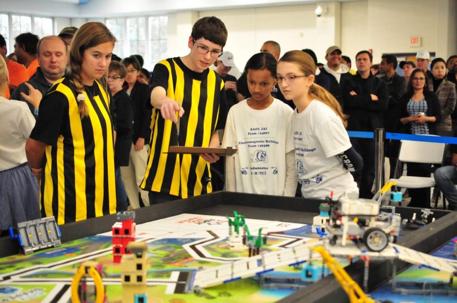 Judges Sarah Korczukowski and Tom Finnegan give feedback to students after a match. (Photo by Elisha Stenger)