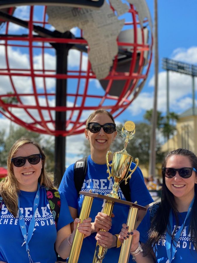 Pictured are Coach Kayla Tietz (left), Coach Elizabeth Horvath (middle) and Coach Kim Yapalola (right) holding the seventh place 2020 Nationals trophy. (Photo courtesy of Elizabeth Horvath).
