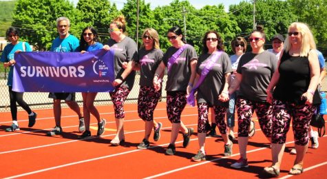 Participants in the 2019 Relay for Life – the last year Warren Hills participated in the national event – walk relay laps on the Warren Hills track. (Photo courtesy of Elisha Stenger)