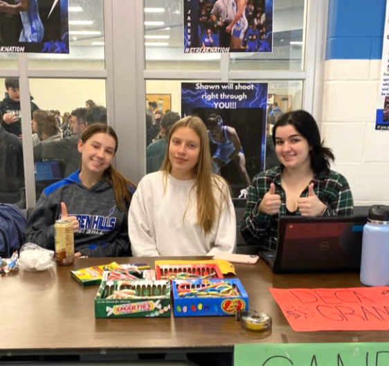 DECA members smile while selling candy grams to fellow Warren Hills Students.