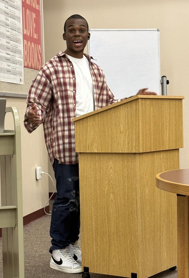 Tyrik Iman-Washington, a returning Poetry Slam reader, shared a moving poem about his roots and identity. “I wrote this poem because I love poetry and wanted to participate in the poetry slam again,” he said, “so I just wrote what came to me first.”  
(Photo by Sophie Picone)