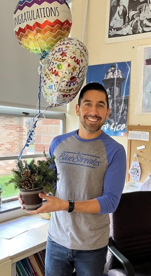 Warren Hills Spanish Teacher Cesar Mendes balances balloons and other gifts he received upon being named 2022-23 Governor’s Educator of the Year. (Photo courtesy of Amanda Brown)