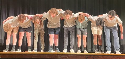 Eight seniors take bows on the high school auditorium’s stage as part of the annual Mr. Warren Hills contest April 26. (Photo by Alana Padilla)