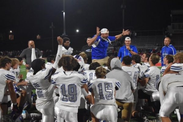 Coach G. inspiring his team while he jumps for joy. (Photo courtesy of Cindy Daniel)